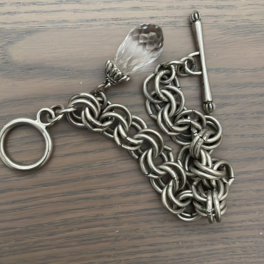 NEW silver toggle bracelet with charm.Approx. 8 inches in length.costume jewerly
